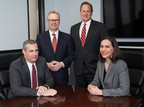 Group photo of attorneys from Burns & Hansen